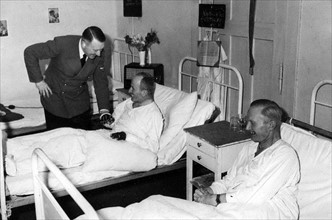 German Chancellor Adolf Hitler visits war wounded in a military hospital 1941