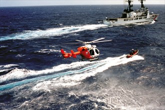 US Coastguard patrol boat with dinghy and helicopter 2012