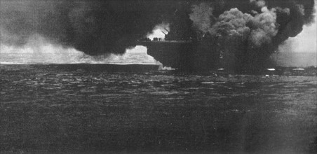 Photograph of the USS Bunker Hill after an attack from another ship