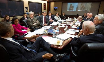 President Obama conveying a National Security Council meeting in the Situation Room of the White House to discuss matters in Ukraine