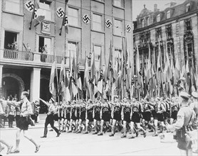 Photograph of Hitler Youth members marching in celebration of Adolf Hitler's Birthday