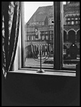 Photograph of a Jewish menorah on a window ledge in Nazi Germany