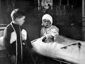 Photograph of wounded children in hospital after an air raid during World War One