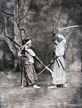 Japanese warrior with young student training in swordsmanship; Japan;