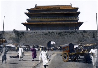 Hand-coloured photograph of the gateway leading toward the Emperor's Palace, Peking. By Felice Beato