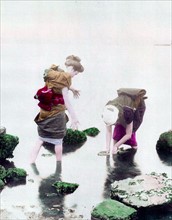 Hand-Colour photograph of women in river, photographed by Ogawa Kazumasa