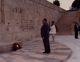 Prime Minister Robert Muldoon of New Zealand laying a reef at a war memorial in Athens