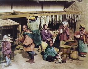 Hand-coloured photograph of Japanese people by Felice Beato