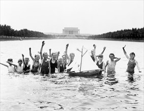 boys playing in the reflecting pool, Washington DC USA 1926
