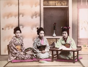 Traditional Japanese women sit singing songs, 1892