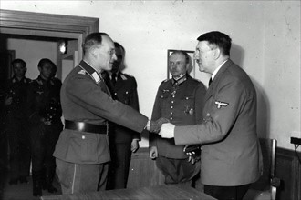 Adolf Hitler awards the Iron Cross to Lieutenant General Rainer Stahel