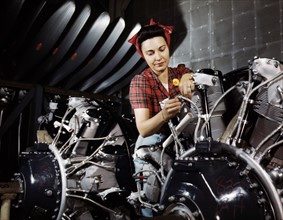World War Two, American Woman working on an airplane