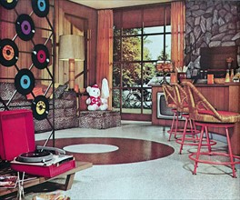 American domestic interior showing portable Vinyl Record player and discs, USA 1965