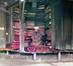Colour photograph of a Russian fabric merchant by Sergey Prokudin-Gorsky