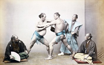 Hand-coloured photograph of Japanese sumo wrestlers by Felice Beato