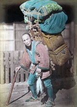 Hand-coloured photograph of Coolie at Fjiyama by Felice Beato