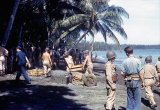 American troops unloading supplies on the shores of Guadalcanal Island.