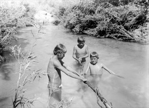 Havasupai Indian boys bathing in the Havasu River, Arizona