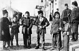 Photograph of children of different ethnic groups in a street, Ottoman Turkey