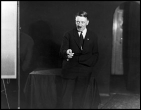 Photograph of Adolf Hitler rehearsing his speech in front of a mirror