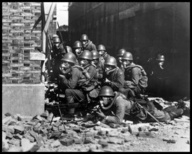 Photograph of Japanese Special Naval Landing Forces with gas masks and rubber gloves during a chemical attack, Battle of Shanghai