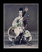 Hand-coloured photograph of a Japanese archer Photographed by Felice Beato