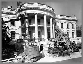 Photograph of construction equipment outside the White House during major renovation
