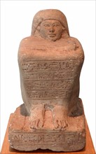 Egyptian block statue of a scribe called Huy.