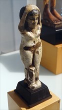 Egyptian tomb statue of a female. Faience.