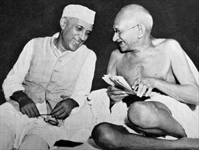 Pandit Jawaharlal Nehru, later Prime Minister of India, (left) with Mohandas Karamchand Gandhi