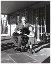 US President Franklin Roosevelt holds his dog