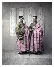Chinese men in matching traditional dress, c, 1870s