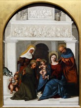 The Holy Family with Saint Francis' by Lodovico Mazzolino