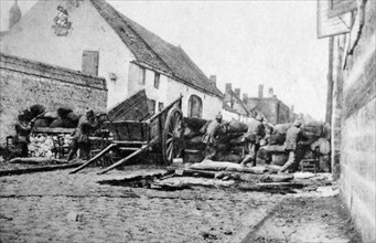 Photograph of combat barricades in the streets of St. Laurent
