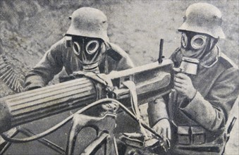 World war one: German soldiers in gas masks use a machine gun