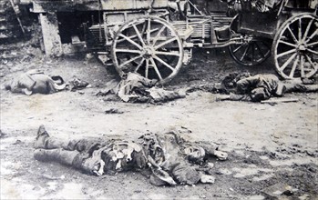 Photograph of a soldier lying dead on the ground after an explosion