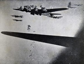 Photograph of Boeing B-17 Flying Fortresses dropping bombs