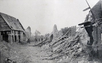 German soldiers advance across a ruined French village