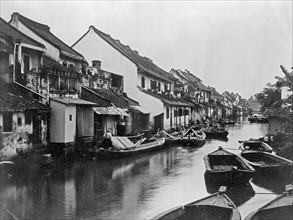Small boats on the village canal in Java