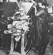 female machine operator in a pencil factory circa 1925