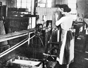female machine operator in a pencil factory circa 1925