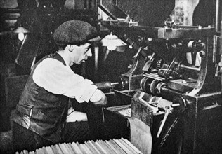 male machine operator in a pencil factory circa 1925