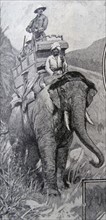 A British national riding on an elephant in India