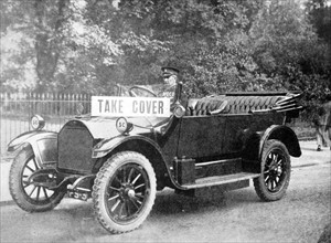 First World War air raid warden driving a car