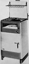 The 'Belling' electric cooker with inner door of armour and a plated glass door