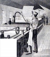 A man managing a water mark machine