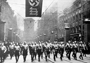 Adolf Hitler and the Nazis marching against the Treaty of Versailles.