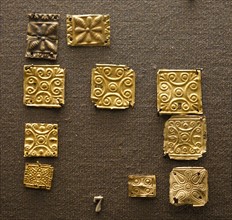 Embossed decorative gold tiles