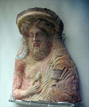 Dionysos holding a kantharos and an egg