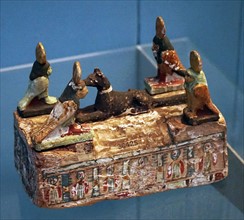 Miniature sarcophagus of painted wood